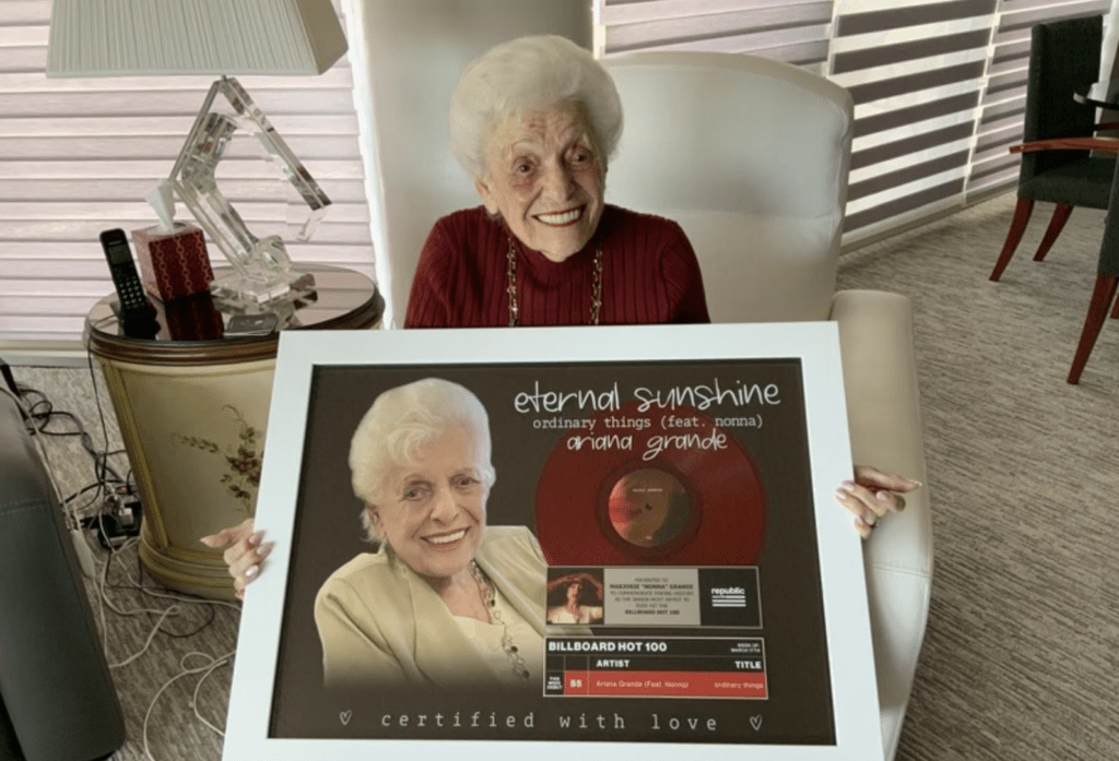 Marjorie “Nonna” Grande holds commemorative plaque